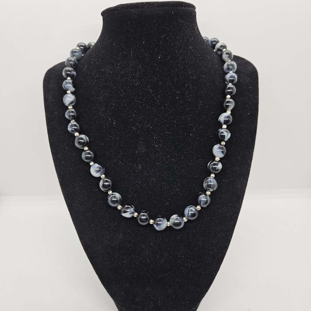 black and gray marbled beaded necklace with gold tone separators
